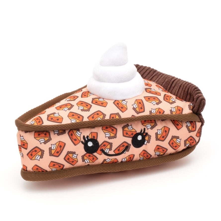 A plush dog toy that looks like a slice of pumpkin pie with whipped cream on top